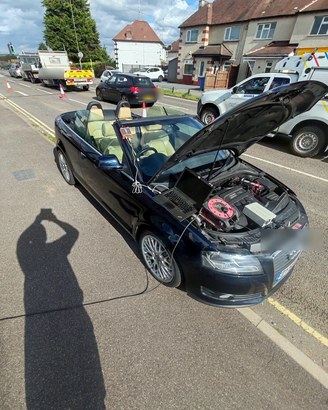 Mobile ECU programming setup on an Audi